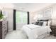 Comfortable main bedroom with a large window, soft carpet, neutral walls, and stylish decor at 5722 Knox Ln, Kannapolis, NC 28081