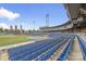 Expansive stadium view showcasing rows of blue seats and the sports field under a bright, partly cloudy sky at 5722 Knox Ln, Kannapolis, NC 28081