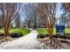 Beautiful pathway through Village Park, lined with trees and leading to serene green spaces at 5782 Knox Ln, Kannapolis, NC 28081