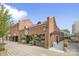 An inviting beer garden with exposed brick, signage, outdoor seating, and planters at 5782 Knox Ln, Kannapolis, NC 28081