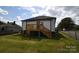 Home backyard features wood deck and lawn at 62 Fourth St, Cramerton, NC 28032
