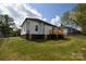 Home backyard with wood deck and lush lawn at 62 Fourth St, Cramerton, NC 28032