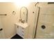 Bathroom with a stylish vanity, arched mirror and a shower at 62 Fourth St, Cramerton, NC 28032
