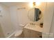 Bright bathroom featuring gold accents and a stand up shower at 62 Fourth St, Cramerton, NC 28032