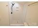 Bathroom stand up shower featuring gold fixtures and modern tiling at 62 Fourth St, Cramerton, NC 28032