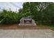 Goat Island Park & Greenway sign, surrounded by lush greenery and trees at 62 Fourth St, Cramerton, NC 28032