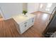 Bright kitchen island with shaker cabinets and white countertops at 62 Fourth St, Cramerton, NC 28032
