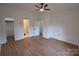 Bedroom with hardwood floors, walk-in closet and en suite bathroom at 62 Fourth St, Cramerton, NC 28032