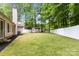 Backyard featuring a new fence, lush lawn, and a shed; great view of a verdant space at 6736 Raeburn Ln, Charlotte, NC 28227