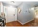 Welcoming foyer featuring hardwood floors, neutral paint, and ample natural light at 6736 Raeburn Ln, Charlotte, NC 28227