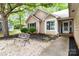 Inviting home exterior showcasing a stone walkway, colorful landscaping, and a charming entrance at 6736 Raeburn Ln, Charlotte, NC 28227