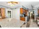 Kitchen with an island with a granite countertop and wood cabinets at 6736 Raeburn Ln, Charlotte, NC 28227