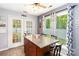 Cozy kitchen with sliding french doors leading to the back yard at 6736 Raeburn Ln, Charlotte, NC 28227