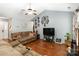 Bright living room with vaulted ceilings, hardwood floors, and ample natural light at 6736 Raeburn Ln, Charlotte, NC 28227
