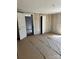 Spacious bedroom featuring wood paneling, multiple closets and doorways at 723 Pee Dee Ave, Albemarle, NC 28001