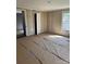 Spacious bedroom featuring wood paneling, multiple closets and a window at 723 Pee Dee Ave, Albemarle, NC 28001