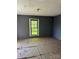 Bedroom showcasing a window view of the yard and gray walls at 723 Pee Dee Ave, Albemarle, NC 28001