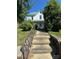 View of a two-story home with steps leading to a covered porch at 723 Pee Dee Ave, Albemarle, NC 28001