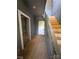 Hallway featuring carpeted stairs and aged walls at 723 Pee Dee Ave, Albemarle, NC 28001