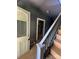 Hallway with stairs and an old door at 723 Pee Dee Ave, Albemarle, NC 28001