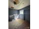 Features a sink, peeling ceiling, and a window, presenting a restoration opportunity at 723 Pee Dee Ave, Albemarle, NC 28001