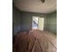 A room leads to another room with stairs; both have floors covered with brown material at 723 Pee Dee Ave, Albemarle, NC 28001