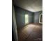 A room with two windows, with floors covered in brown construction paper at 723 Pee Dee Ave, Albemarle, NC 28001