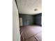 A room with decorative molding and brown paper covering the floor at 723 Pee Dee Ave, Albemarle, NC 28001