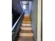 Carpeted stairs with gray painted banister and walls at 723 Pee Dee Ave, Albemarle, NC 28001