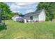 Spacious backyard with a deck, shed, and mature trees at 744 Chipmeadow Ln, York, SC 29745