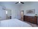 Bright bedroom featuring a ceiling fan, ensuite bathroom, and a large dresser at 744 Chipmeadow Ln, York, SC 29745