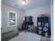 Bedroom featuring a window, black desk and chair, and light rug at 744 Chipmeadow Ln, York, SC 29745
