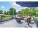 Relaxing outdoor deck area with comfortable seating and a large umbrella at 744 Chipmeadow Ln, York, SC 29745