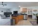 Open-concept kitchen features black granite countertops, tile floors, and stainless steel appliances at 744 Chipmeadow Ln, York, SC 29745