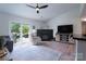 Bright living room with a fireplace, sliding glass door and neutral color scheme at 744 Chipmeadow Ln, York, SC 29745