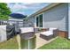 Outdoor patio area featuring a firepit and comfortable seating with a grill at 744 Chipmeadow Ln, York, SC 29745