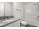 This bathroom features a granite countertop, white cabinetry, and a shower over tub combo at 7616 Monarch Birch Ln, Charlotte, NC 28215