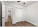 Bedroom boasts spacious closet and neutral décor, creating a serene atmosphere at 7616 Monarch Birch Ln, Charlotte, NC 28215