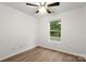 Cozy bedroom with ceiling fan, and large window with outdoor view at 7616 Monarch Birch Ln, Charlotte, NC 28215
