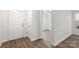 Welcoming foyer with wood-look flooring, white walls, and ample natural light at 7616 Monarch Birch Ln, Charlotte, NC 28215