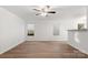Open-concept living area featuring hard surface floors and abundant natural light from multiple windows at 7616 Monarch Birch Ln, Charlotte, NC 28215