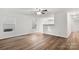 Spacious living room showcasing hard surface floors, a neutral color scheme, and seamless flow to other rooms at 7616 Monarch Birch Ln, Charlotte, NC 28215