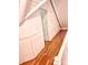 Upstairs hallway featuring hardwood floors and leading to a doorway at 7811 Babe Stillwell Farm Rd, Huntersville, NC 28078
