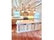 Kitchen island has ample counter space, light fixtures, and wood floors at 7811 Babe Stillwell Farm Rd, Huntersville, NC 28078