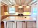 Kitchen island features pendant lighting, modern appliances, and ample counter space at 7811 Babe Stillwell Farm Rd, Huntersville, NC 28078