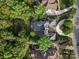 Aerial view showcasing the home's roof and landscaping, surrounded by mature trees at 7906 Skye Lochs Dr, Waxhaw, NC 28173