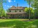 Expansive backyard with covered patio, ideal for outdoor entertaining and relaxation at 7906 Skye Lochs Dr, Waxhaw, NC 28173