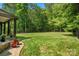Spacious backyard with lush lawn and mature trees, perfect for recreation at 7906 Skye Lochs Dr, Waxhaw, NC 28173