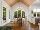 Breakfast nook with a dining table, surrounded by large windows offering backyard views at 7906 Skye Lochs Dr, Waxhaw, NC 28173