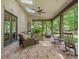 Relaxing covered patio with comfortable seating and wooded views at 7906 Skye Lochs Dr, Waxhaw, NC 28173